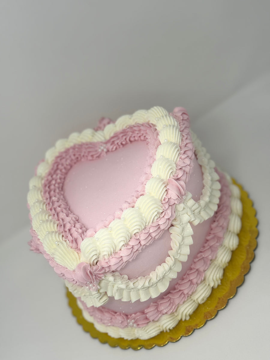 Vintage cakes are a style that evokes a sense of nostalgia and elegance. The colors are usually softly muted, and the shape can be round or heart-shaped. It's the perfect choice for weddings, anniversaries, birthdays, or any special celebration that calls